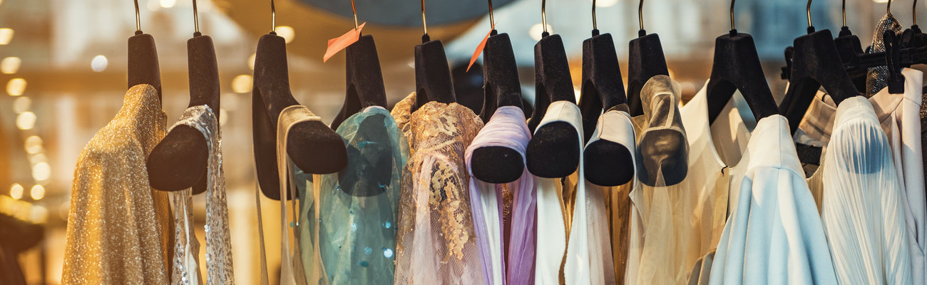 Colorful clorhes on racks in a fashion boutique
